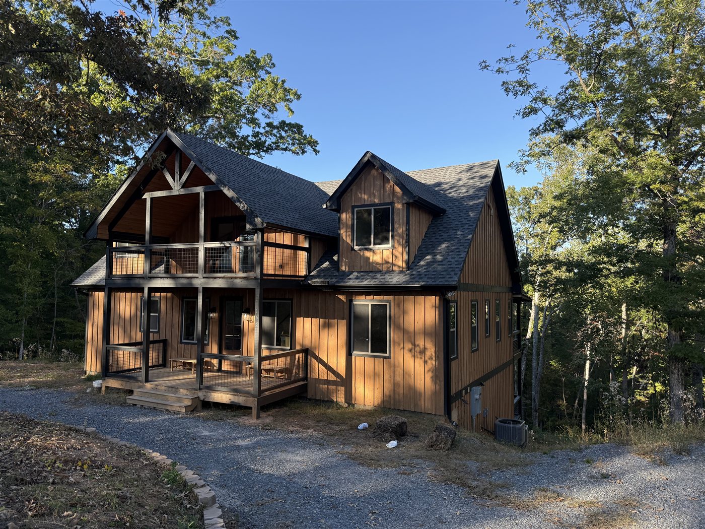 Barrel Knot Retreat two-story porch and forest setting